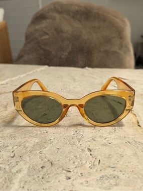 Translucent Honey Oval Sunglasses with Green Lenses